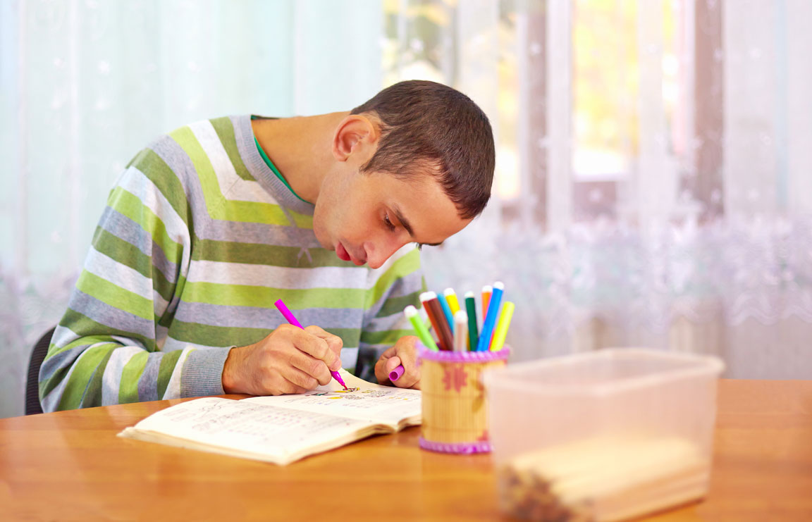 male adults with special needs drawing