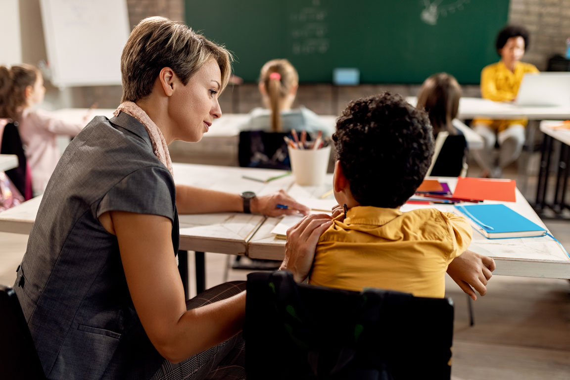 elementary school teacher assisting