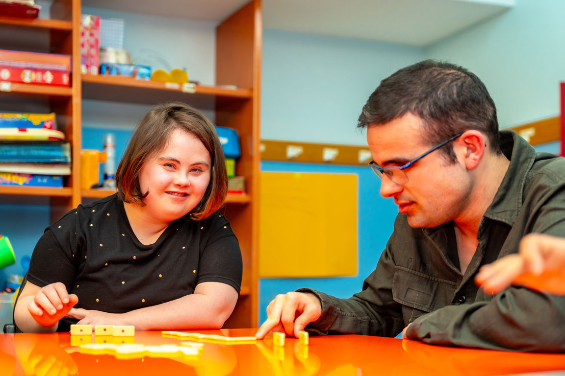 young adults with special needs playing dominos
