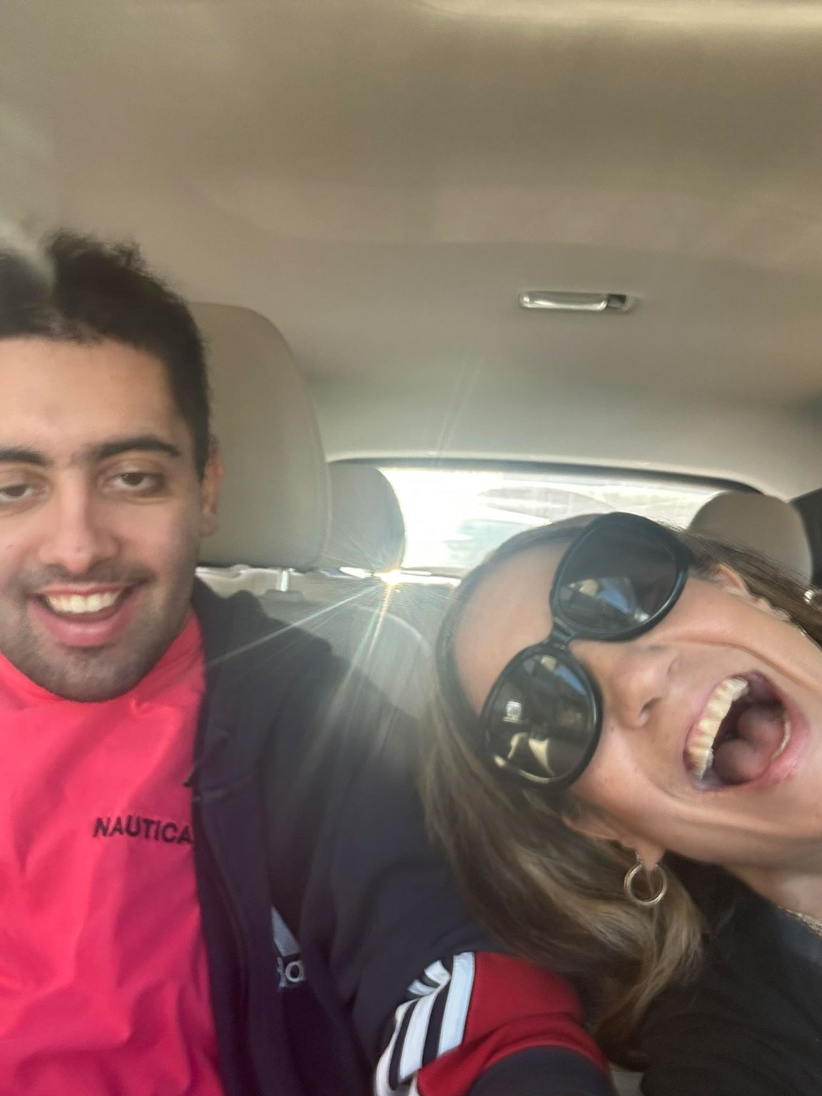 Johanna and Aidan smiling in the car